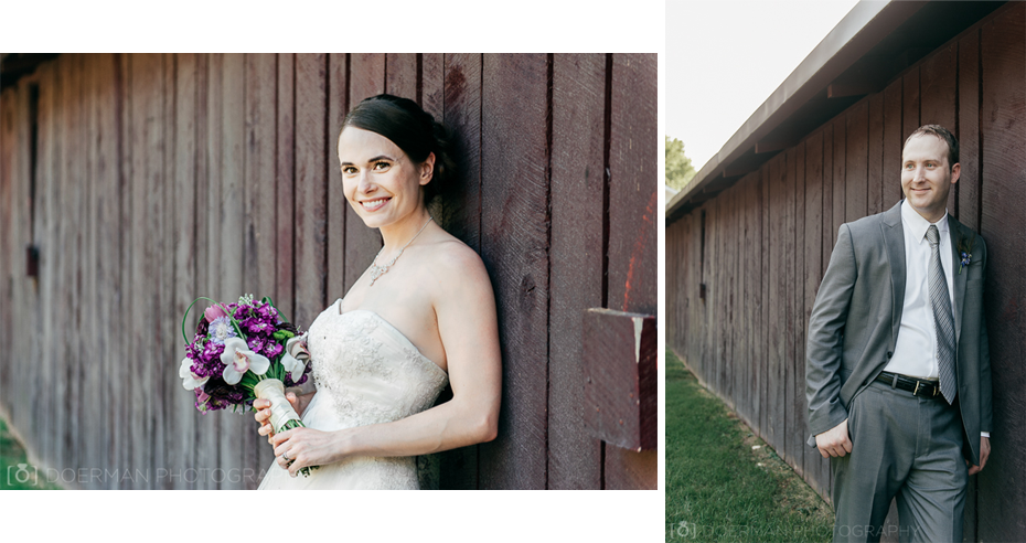 Bride and groom against barn